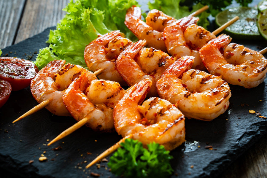 Grilled, seasoned, and skewed shrimp